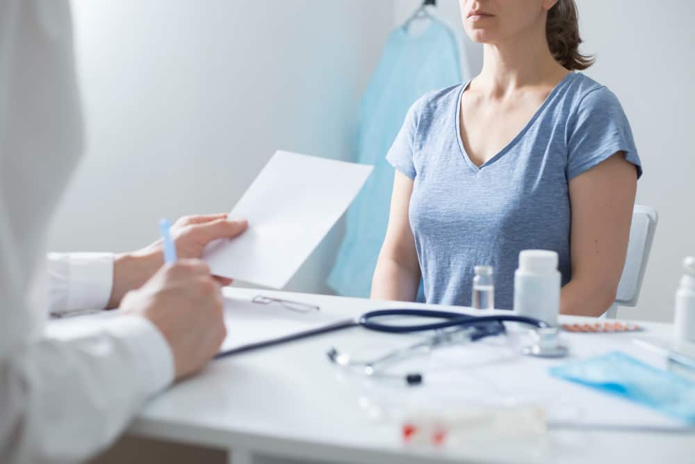 woman consultation with doctor female appointment with gynecologist breast cancer